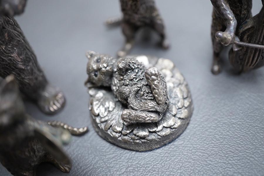 An Elizabeth II silver four piece miniature cat band by S.J. Rose & Son, Birmingham, 1976, tallest 58mm, together with a modern 925 miniature model of a standing grizzly bear and a modern silver model of a kitten(filled)